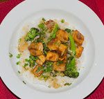 Crispy Lemon Tofu with Broccoli Recipe Click to Print Crispy Lemon Tofu with Broccoli Published by Tony Bailey on March 11, 2013 Sweet, Tangy and Delicious Prep time: 20 minutesCook time: 20 minutes Total time: 40 minutes Yield: 4 servings Ingredients 1 Tablespoon Corn Starch 1/2 Cup Lemon Juice 1 Cup Flavorful Stock 2 Teaspoons Garlic 2 Teaspoons Ginger 1 Tablespoon Brown Sugar 1 Tablespoon Honey 1 Teaspoon Soy Sauce 1/2 White Onion 2 Cups Steamed Broccoli 1 Block Crispy Tofu Instructions Warm the stock and dissolve the corn starch to make the slurry Mix in the lemon juice, 1 teaspoon of the ginger, 1 teaspoon of the garlic, brown sugar, honey and soy sauce In a wok, or large pan, saute the onions in a small amount of oil for about 5 minutes Add the steamed broccoli, remaining garlic & ginger and saute for another 3-5 minutes Add the lemon sauce, bring to a boil and then reduce the heat to begin reducing it. As it reduces, it will begin to thicken The sauce will take about 10 minutes to thicken, depending on how quickly you boil it Just before you pull the dish to plate it, add the tofu to coat it with the sauce. Serve over sticky rice (short grain white or brown rice)