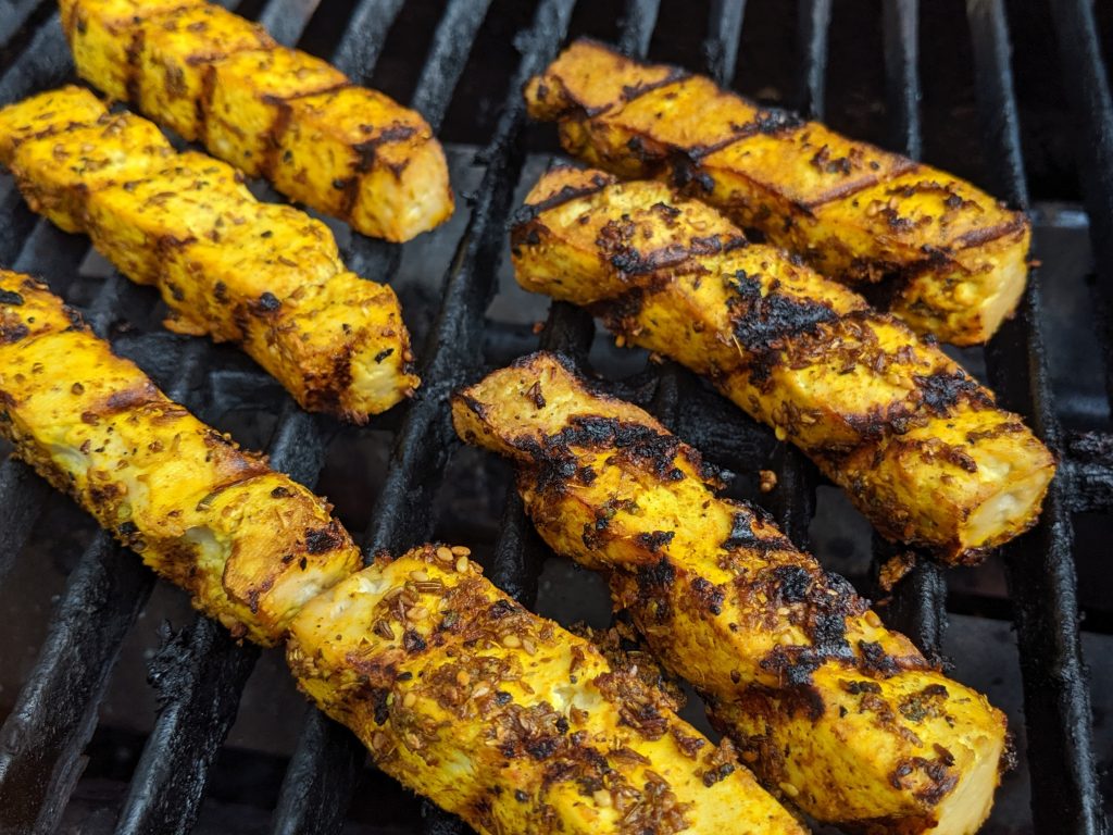 Shawarma marinated tofu on the grill